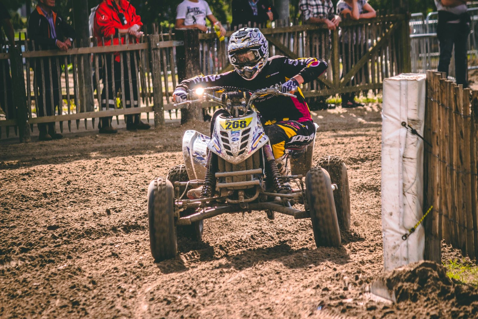 person riding ATV on mud road